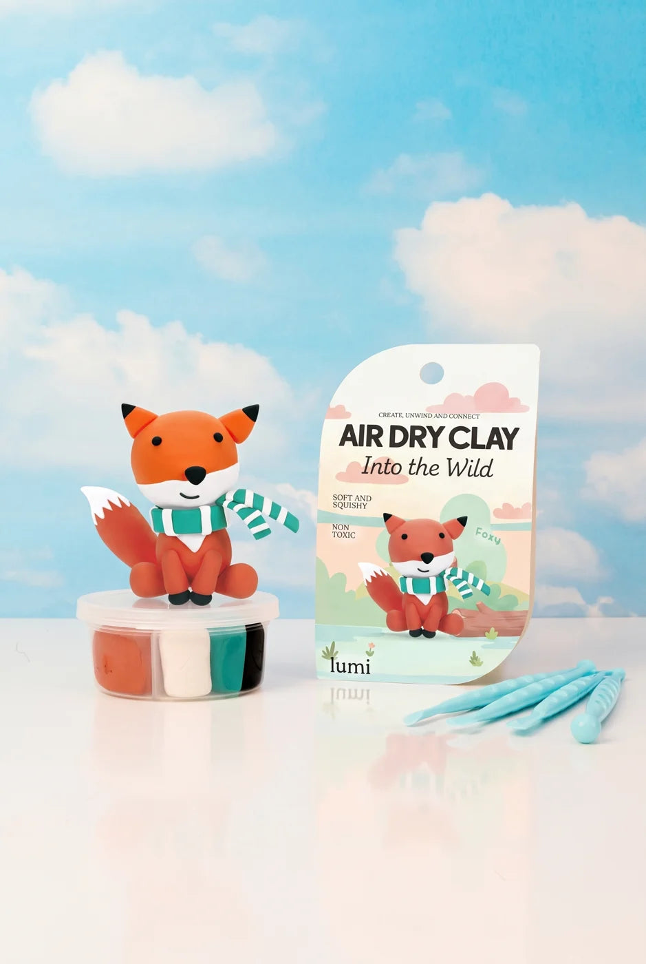 Foxy clay character with colourful clay, tools and an Into the Wild instruction card